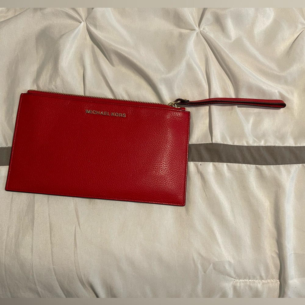 Michael kors wristlet RED with gold accents.